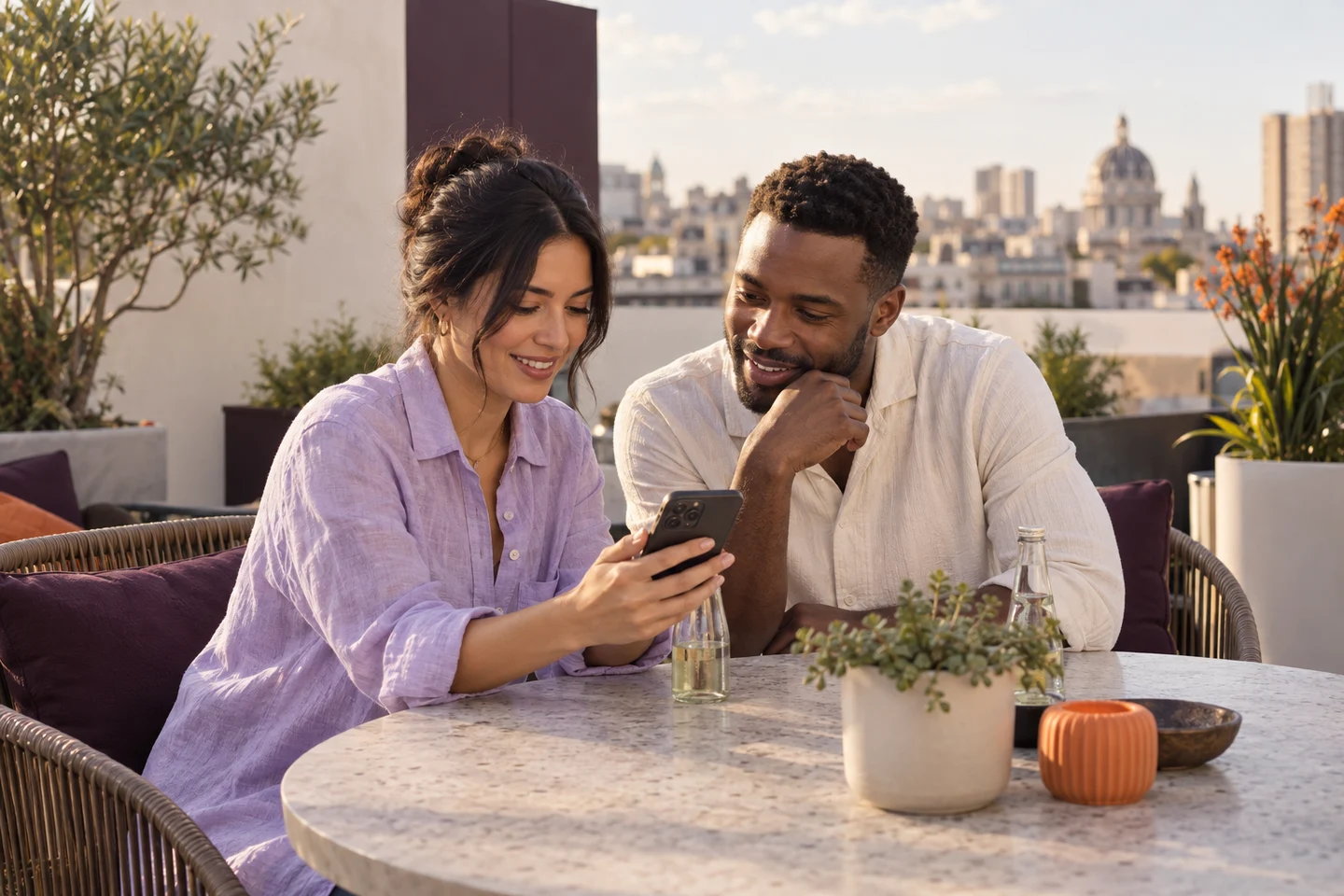 Two adult friends checking a phone together as they plan their evening